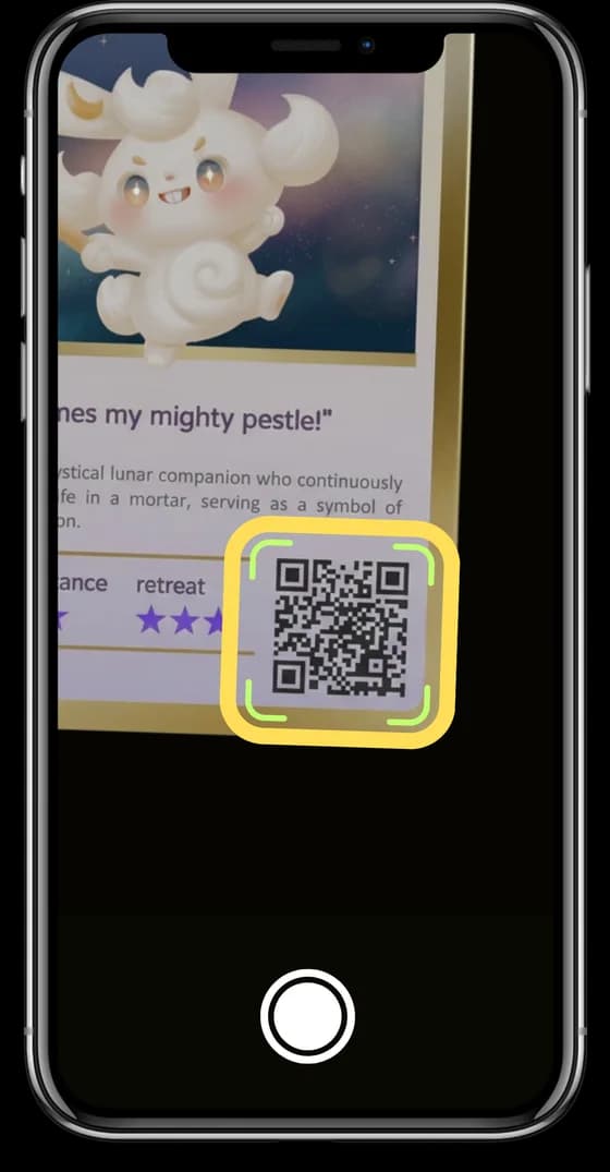 A phone scanning the QR code on the Jade Rabbit monster card